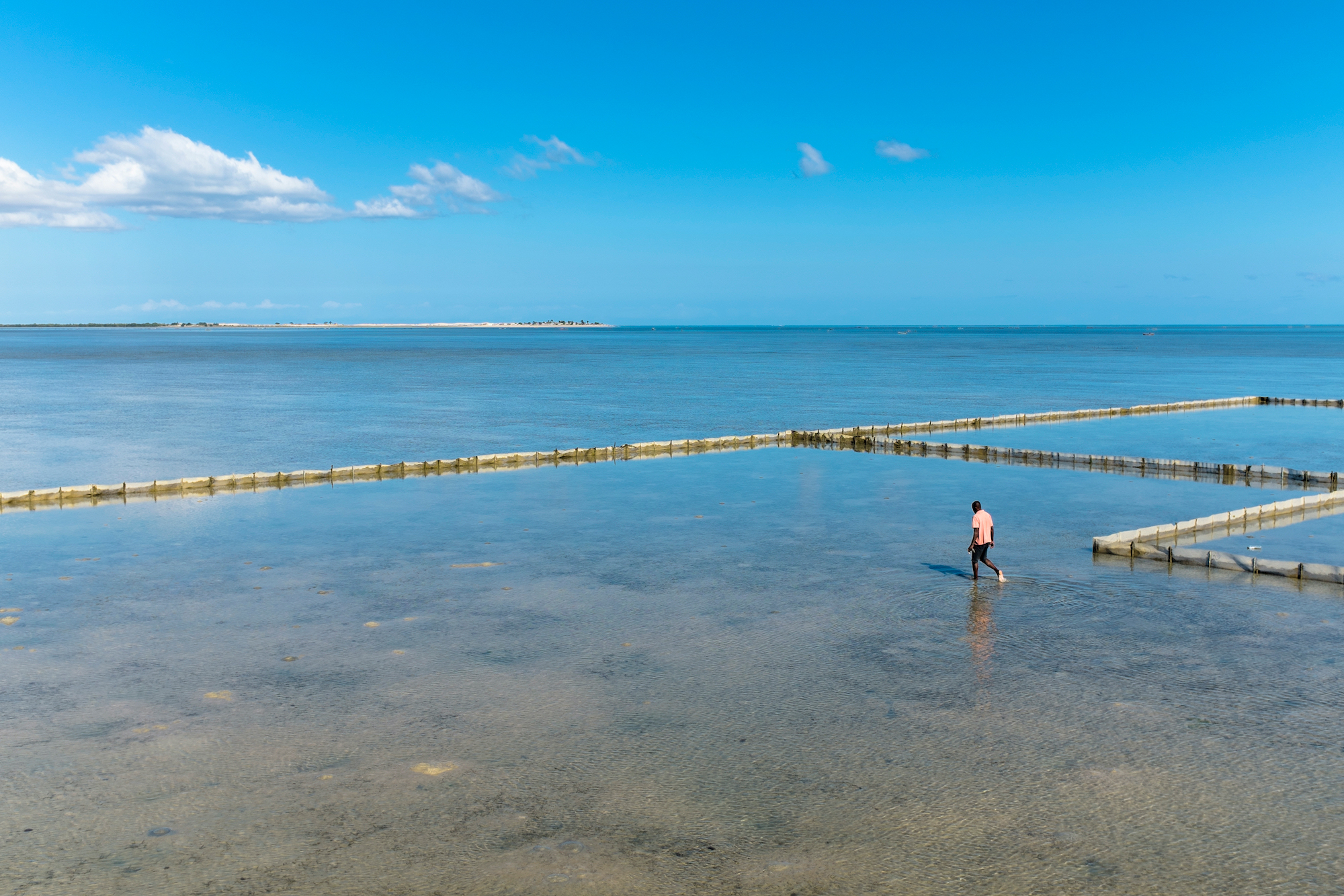 A Malagasi ranger patrols a sea cucumber farm on the coast - Photograph by Toby Smith